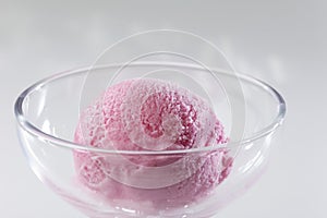 Close up of Scoop of delicious real fresh ice cream in Strawberry flavour. photo