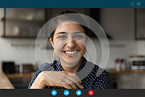 Screen view of smiling Indian woman talk on video call