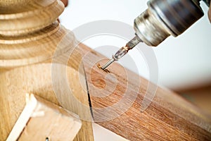 Close up screwdriver auto machine is screwing the nut in to the wood. image for background