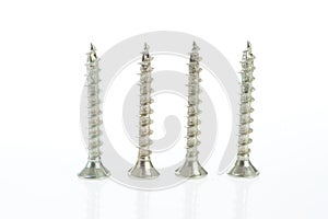 Close-up of screws on a white