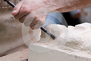Close up of a sculptor at work photo