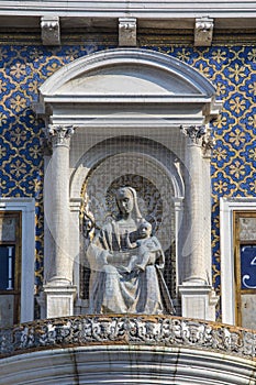 Sculpture of Virgin and Child on St. Marys Clock Tower in Venice photo
