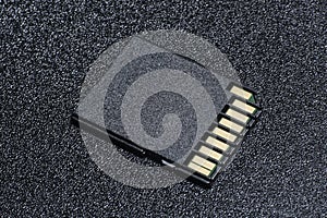 Close up of SD Card on black textured background