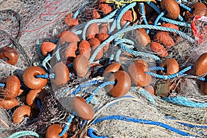 Close up sea fishnet with colorful floats