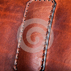 Close-up of a seam floss on a briefcase