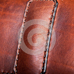 Close-up of a seam floss on a briefcase