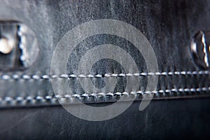 Close-up of a seam floss on a briefcase