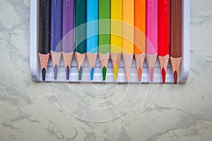 Close up. seamless colored pencils row with wave on lower side . Set of colored pencils on a white background That is arranged in