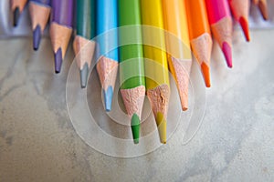 Close up. seamless colored pencils row with wave on lower side . Set of colored pencils on a white background That is arranged in