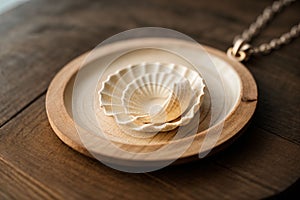 Close-up of a seashell necklace on a wooden table