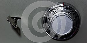 Close-up of security lock and key of safe.