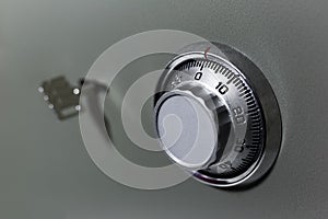 Close-up of security lock and key of safe.