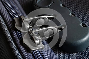 Close-up of a security lock with zipper on a modern suitcase or luggage bag