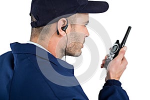 Close-up of security officer talking on walkie-talkie