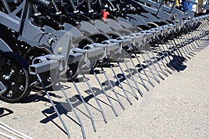 A close-up on seed cum fertilizer drill, sowing equipment, tractor attachment for high tech farming and agriculture