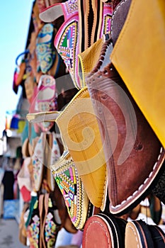 Close up of a selection of handmade babouche slippers on sale, Morocco