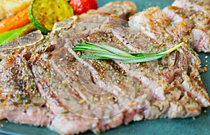 Close up and selective focus shot of beef tender steak with medium rare cooking with juicy fat, grilled and seasoning with spice,