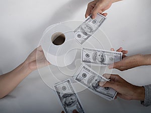 Close up sell buy tissue, hand holds toilet paper tissue and money of 100 US dollars banknote a lot of
