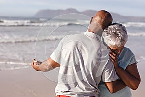 Close up of senior african american couple dancing together on the beach