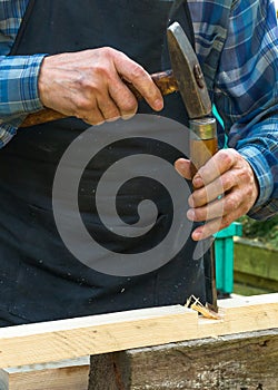 Close-up of senior carpenter hands
