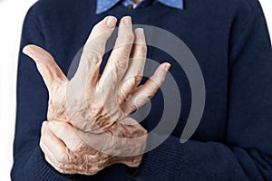 Close Up Of Senior Man Suffering With Arthritis photo