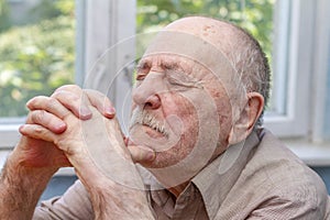 Close up of senior man thinking