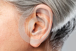 Close up of senior woman ear