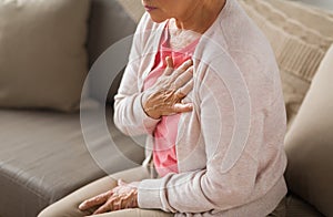 Close up of senior woman having heartache at home