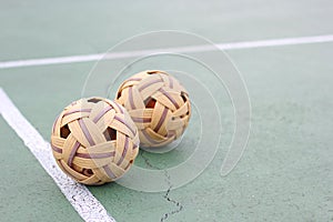 Close up Sepak takraw or Rattan ball in outdoor field with copy space.