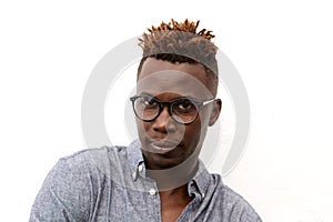 Close up serious african man with glasses against white background