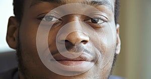 Close-up serious male face, portrait of focused focused african american sad pensive young business man student teenager