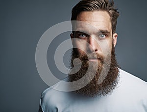Close up on serious man with long beard