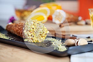 Close up on served cannoli with orange. Italian cuisine pastry. traditional italian dessert with ricotta cheese. Selective focus.