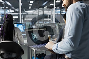 Close up of server hub system administrator optimizing performance with AI