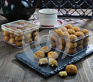 Close-up of a serving of biscuits against a teaset background