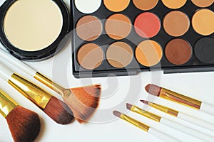 Close up.set of makeup brushes and eyeshadow on white background