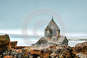 Close up Sevanavank monastic complex building with Sevan lake panorama. Peninsula at the northwestern shore of Lake Sevan in the