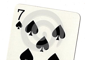 Close up of a seven of spades playing card.