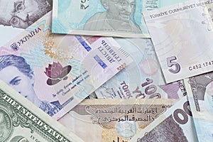 close up of several countries banknotes