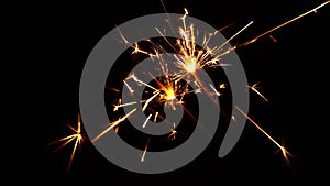 Close up several firework sparklers over black