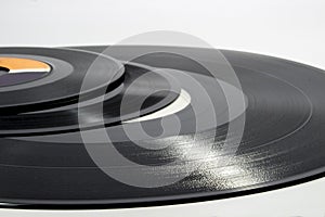 Close-up of several vinyl records of different sizes