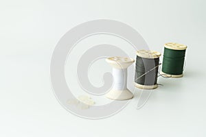 Close up of sewing items,Spool of thread, needle and button