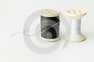Close up of sewing items,Spool of thread, needle and button