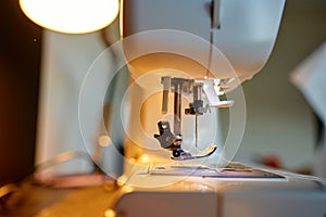 Close-up of sewing machine needle and presser foot