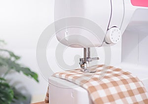 Close up sewing machine stitch new clothing