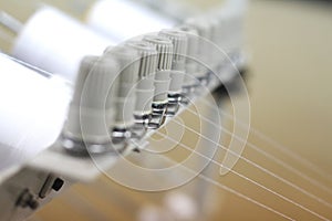 Close up of sewing machine with threads