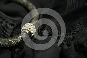 Close up of a  sexy black backgroundwith jewellery