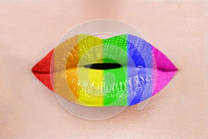 Close up of sexy caucasian woman perfect lips with rainbow lipstick. LGBT, lesbian love and pride concept photo