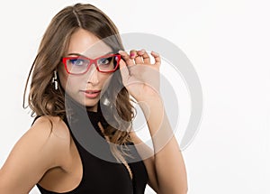 Close-up cute businessgirl in red glasses. fashion and make-up, beauty in business photo