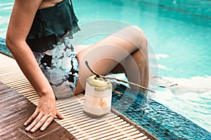 Close-Up of Sexy Woman in Swimsuit Relaxing in Swimming Pool, Beautiful Woman  Relax on The Edge of Poolside at Resort Hotel.